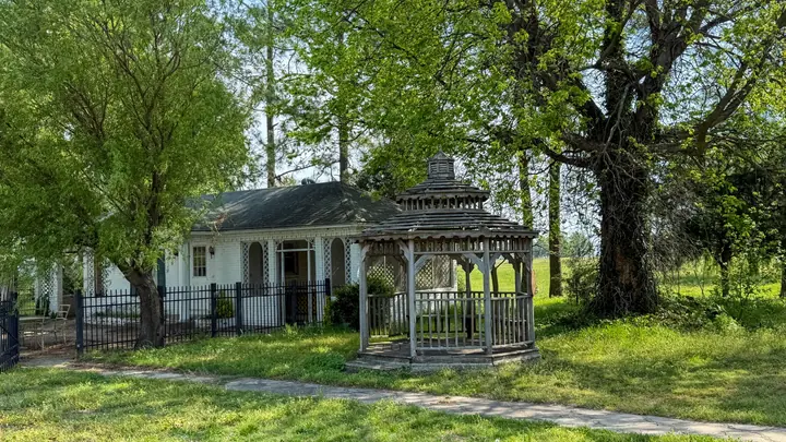 Guest / Pool house area with gazebo and mature shade trees.