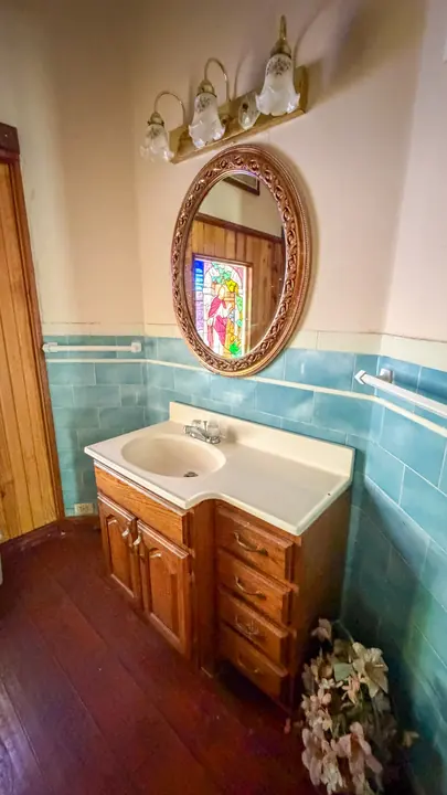 Bathroom vanity and tile detail.